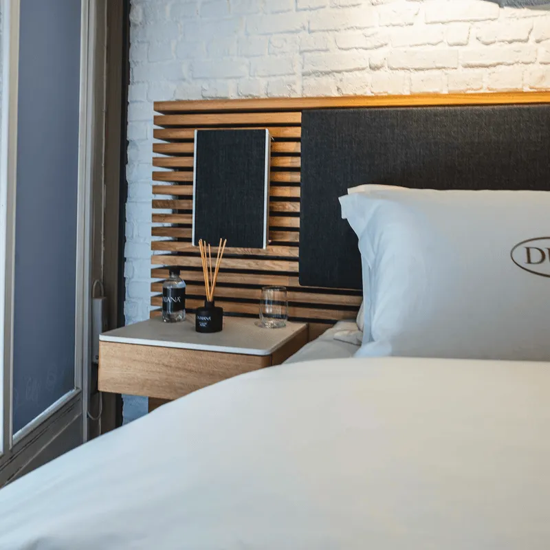 Alongside the headboard, Duxiana has created two custom playlists designed to elevate your sleep routine: Sleep Sounds and Wake Up Sounds. These playlists have been scientifically crafted with careful attention to beats per minute BPM and chord progression to help listeners ease into relaxation and wake up refreshed.

1. Sleep Sounds: A Smooth Transition into Sleep
     The Sleep Sounds playlist is designed to help you fall asleep naturally. Each track is carefully curated, starting at a higher BPM and gradually slowing down to the optimal tempo for heart rate synchronization and relaxation. As you listen, your body is guided into a restful state, complementing the natural rhythms of your sleep cycle.

2. Wake Up Sounds: A Gentle Start to Your Day
     The Wake Up Sounds playlist offers a calming yet energising experience. Starting at a lower BPM and gradually increasing, it allows your body to awaken naturally with the rhythm. This gradual BPM increase mimics your natural wake up process, ensuring a gentle yet invigorating start to your day.

Both playlists are available for streaming on all major platforms, and the best part is that you don't need to own a Duxiana Audio Headboard to enjoy them. However, when paired with the headboards integrated sound system, these playlists take your sleep experience to a whole new level.